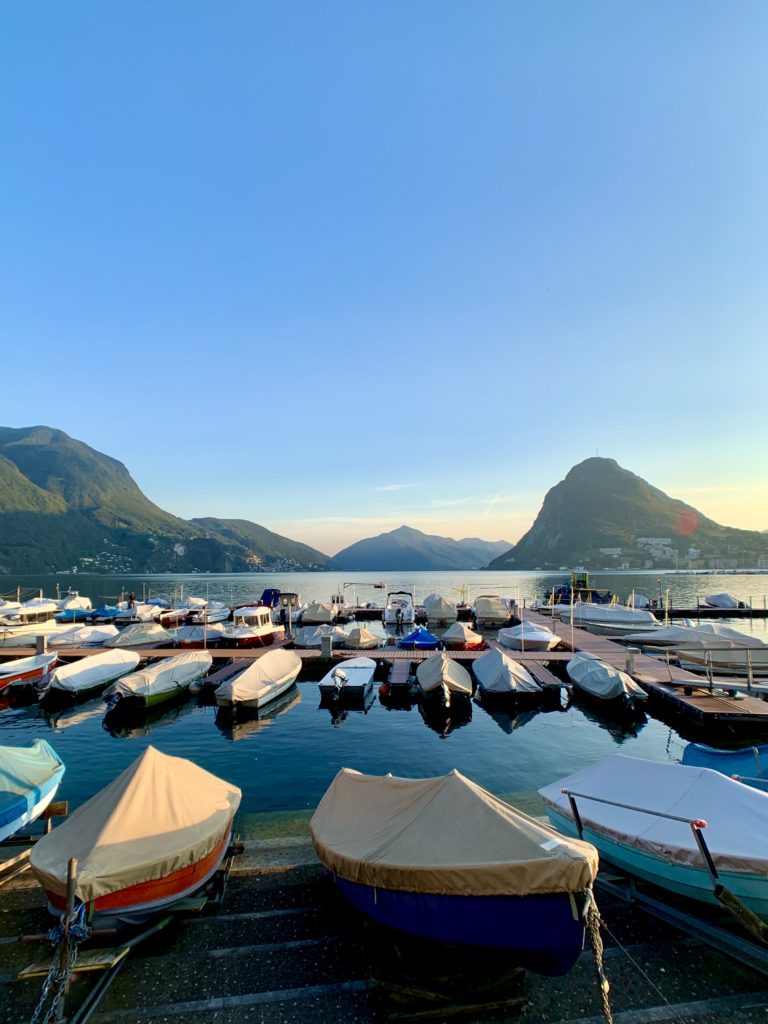 Boats on Lake Lugano at Sunset in Switzerland