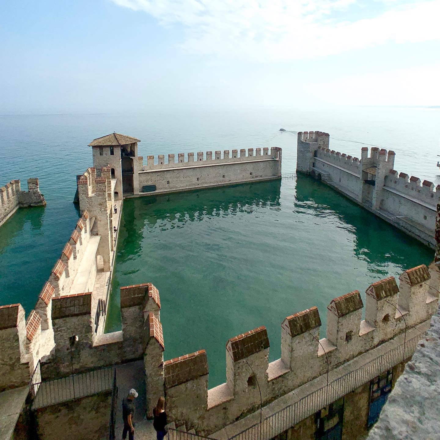 View of the castle waters at Castello Scaligero, Sirmione, Lake Garda, Italy